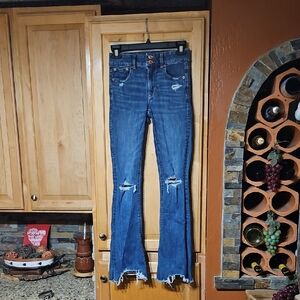 American Eagle Distressed Blue Raw Hem Super Stretch Hi-Rise Artist Flare Jeans